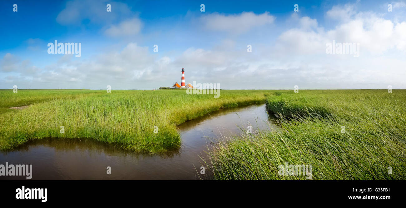Beautiful landscape with famous Westerheversand lighthouse at North Sea in Nordfriesland, Schleswig-Holstein, Germany Stock Photo