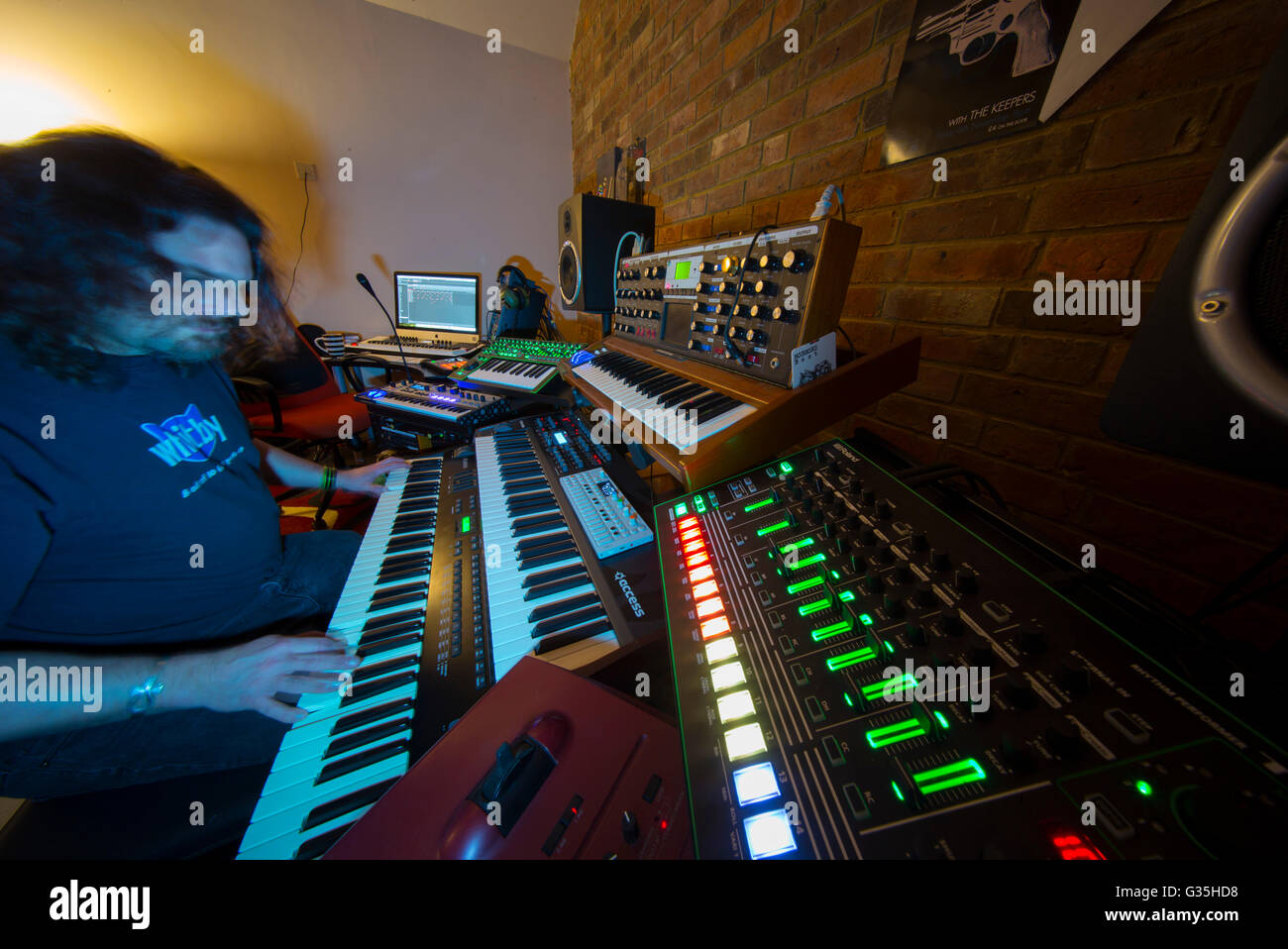 Music studio full of instruments and pc display Stock Photo - Alamy