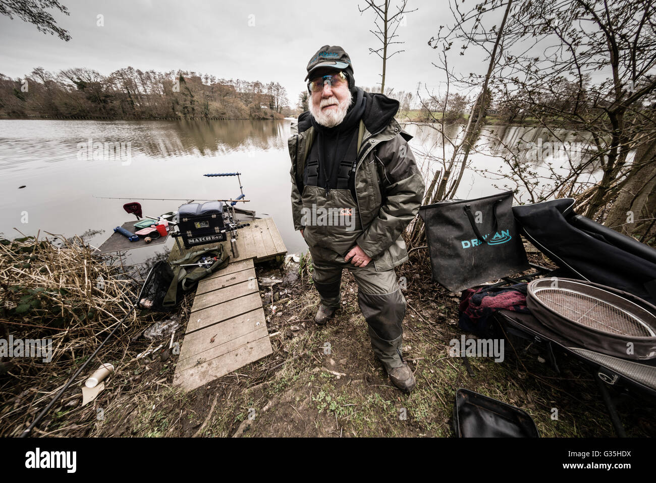 Member of a fishing club which holds contests on Pendigo Lake, a body of water created by the drainage system of the NEC UK Stock Photo