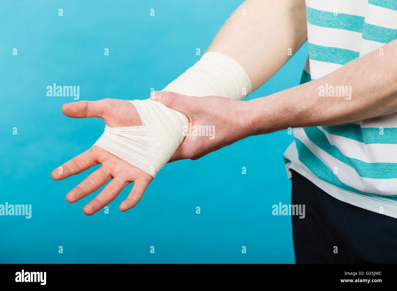 Male bandaged hand holds hi-res stock photography and images - Alamy