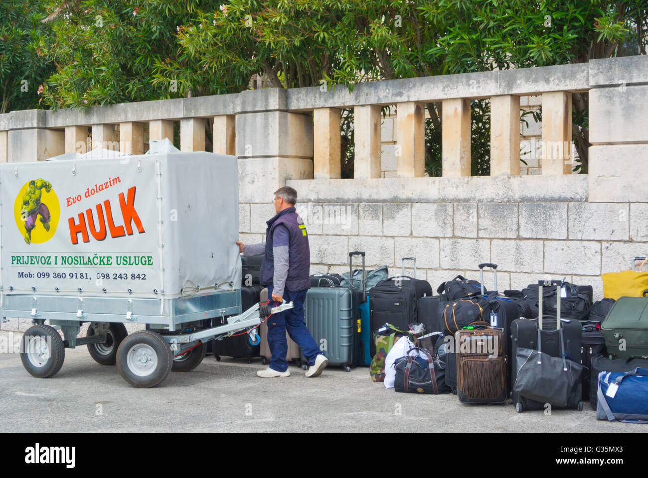 Luggage transportation done by private company, outside Ploce gate of old town, Dubrovnik, Dalmatia, Croatia Stock Photo