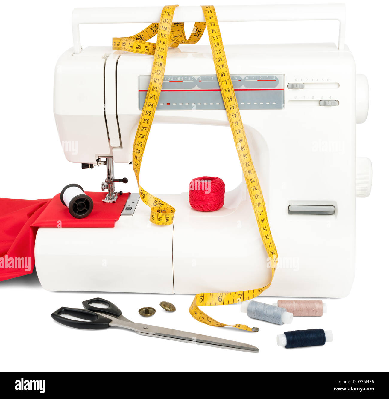 Sewing machine with fabric, threads and scissors Stock Photo