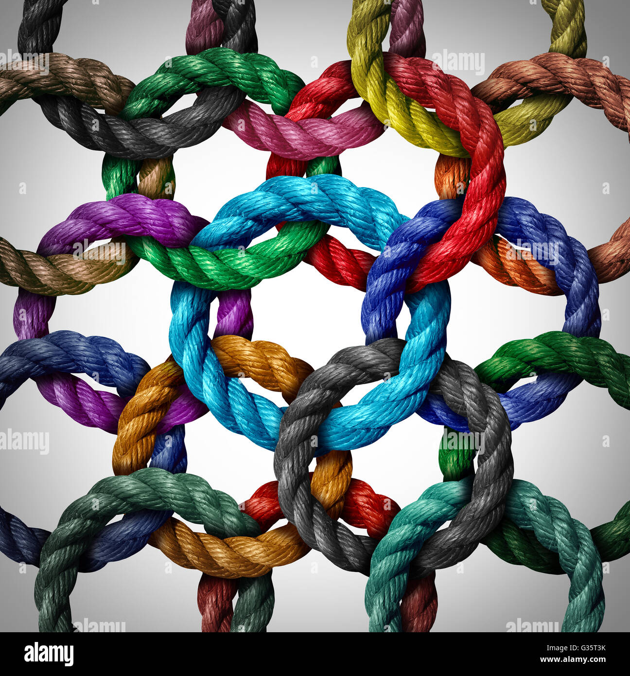 Central networking and network connection business concept as a group of diverse circle ropes connected to a central rope loop as a metaphor for connectivity and linking to a centralized support structure. Stock Photo