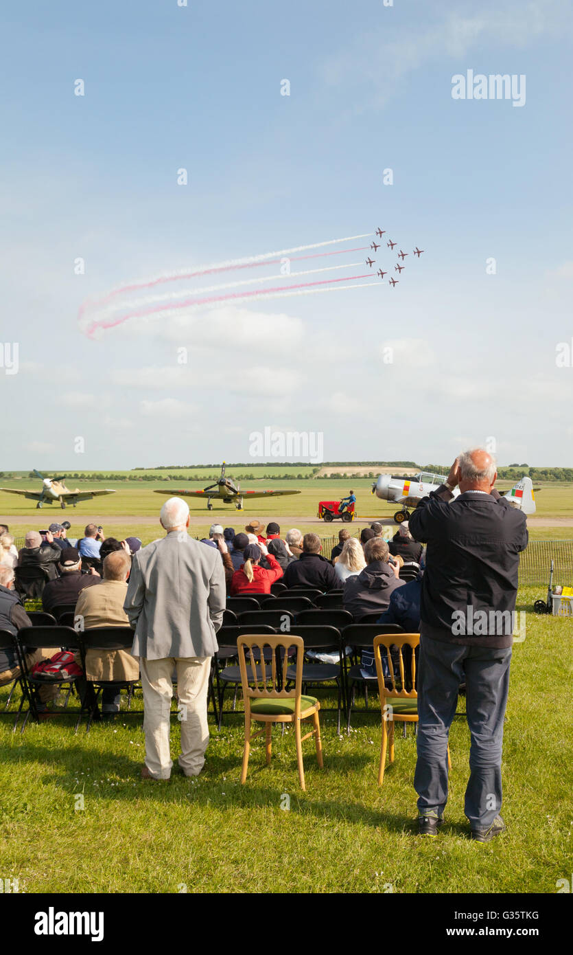 People watching the RAF Red Arrows display team performing, Duxford Airshow, UK Stock Photo
