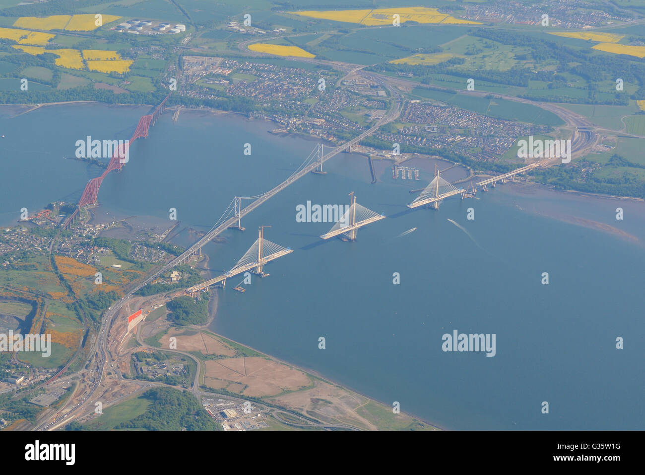 Aerial view of the Forth bridges - The Forth Bridge (rail), Forth Road Bridge and Queensferry Crossing in course of construction Stock Photo