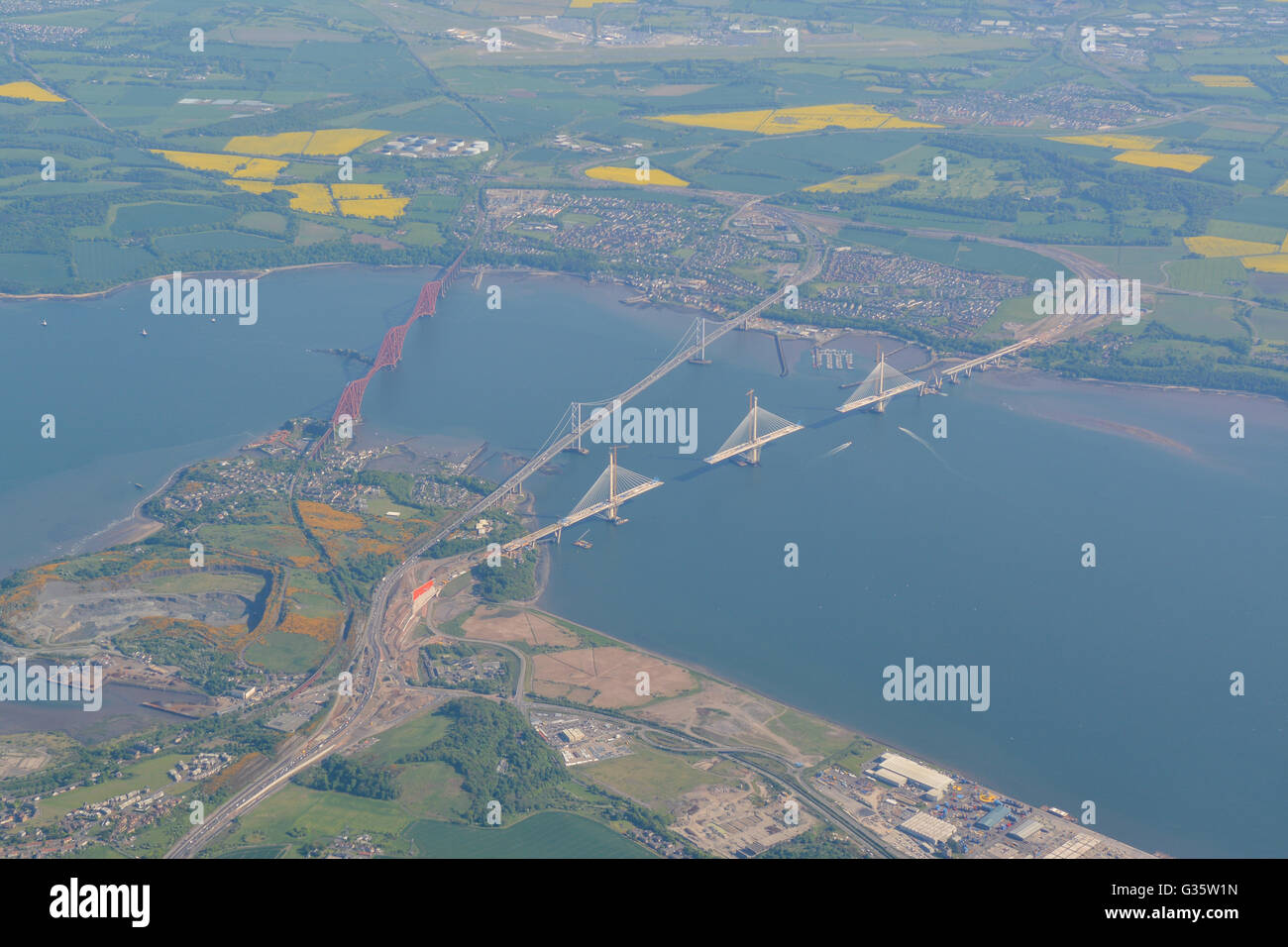 Aerial view of the Forth bridges - The Forth Bridge (rail), Forth Road Bridge and Queensferry Crossing in course of construction Stock Photo