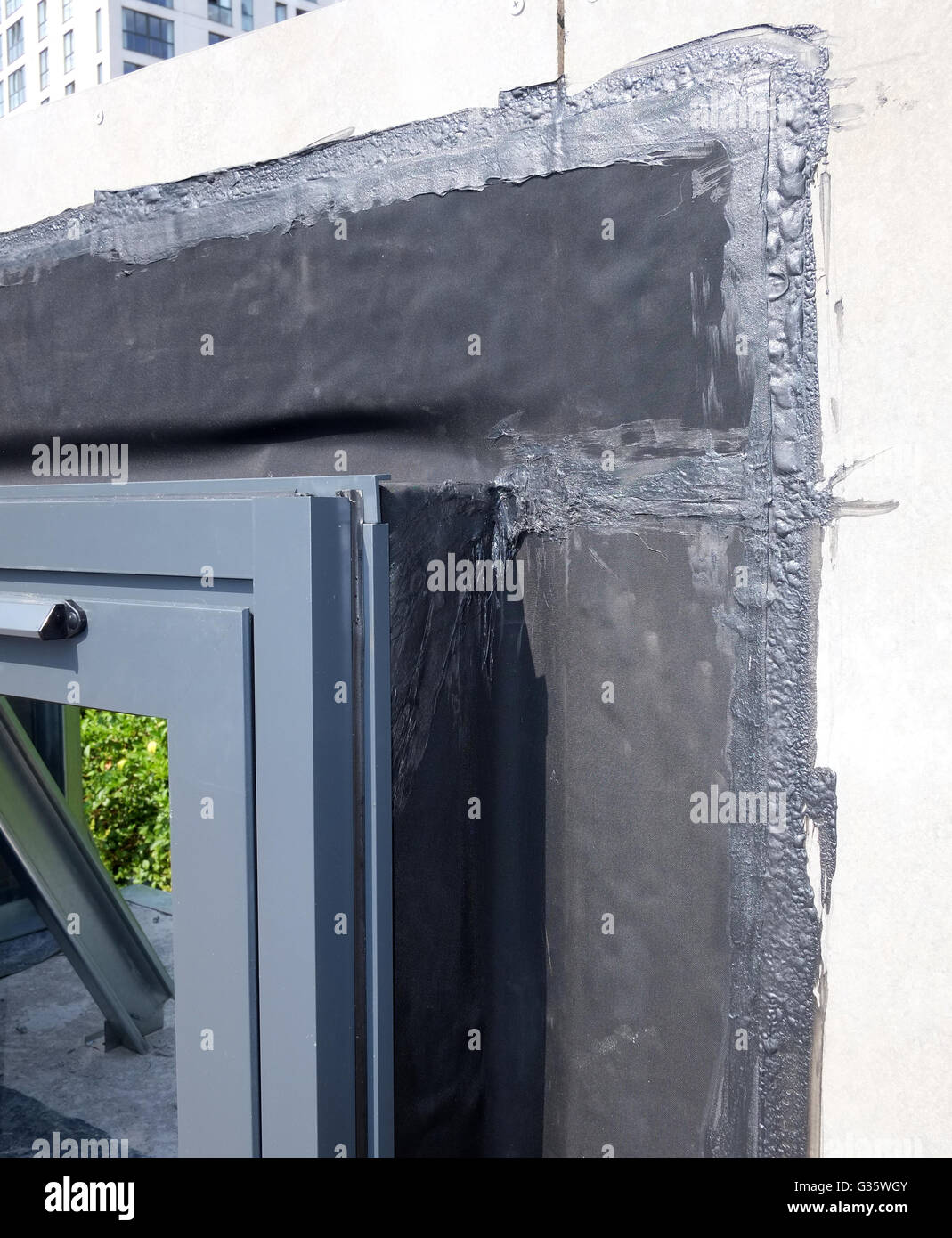Construction detail of a metal window and damp proof membrane. June