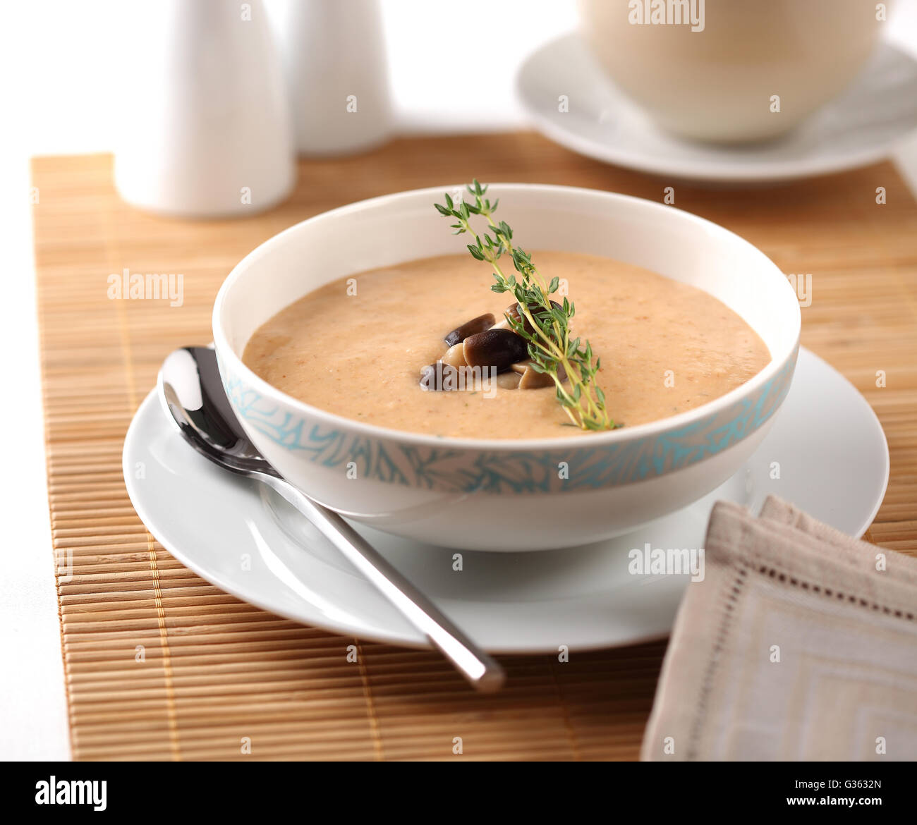 Mushroom cream soup with wild mushrooms and herbs. Stock Photo