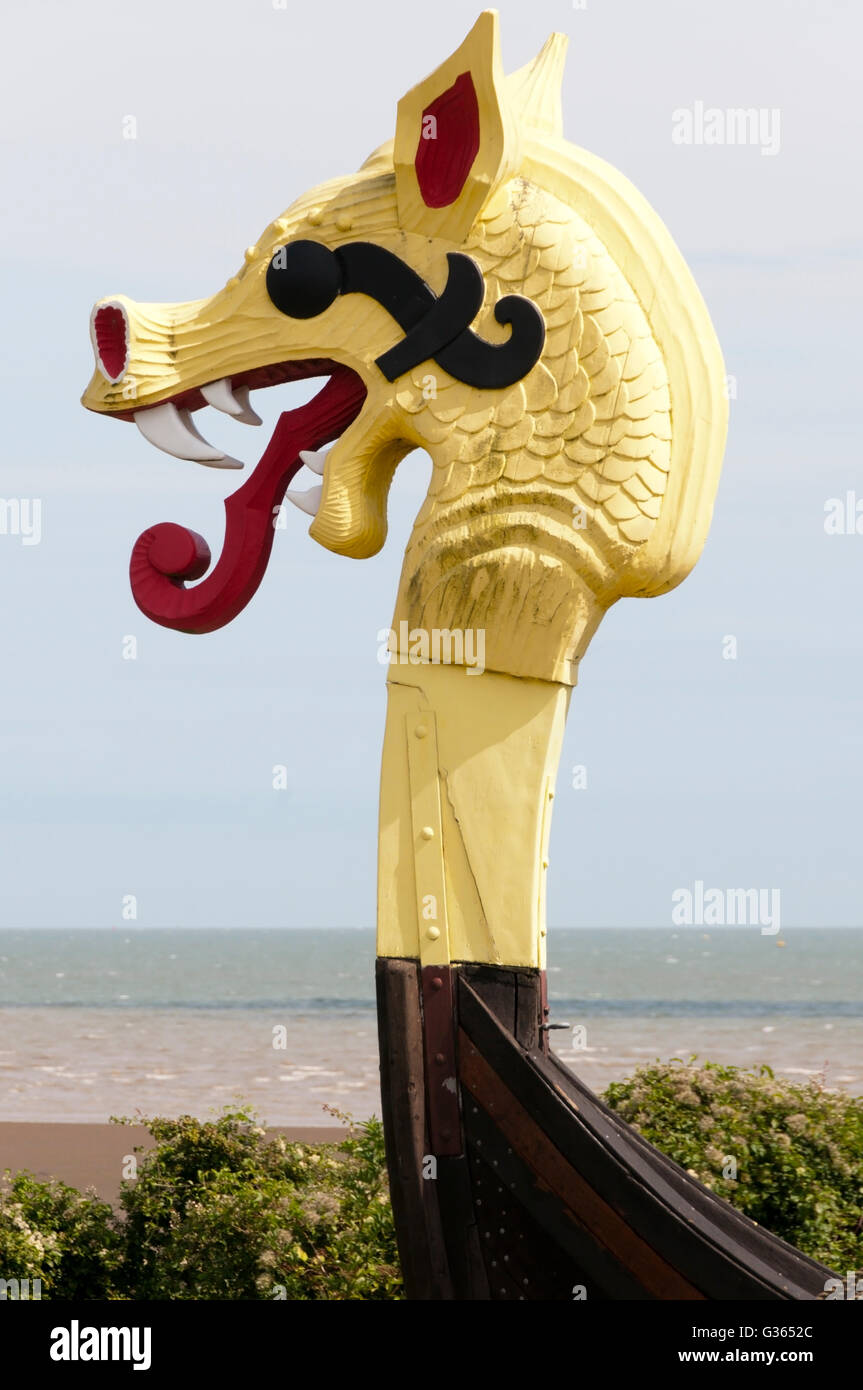 Carved wooden figurehead on the prow of the replica Viking ship Hugin at Pegwell Bay, Kent. Stock Photo