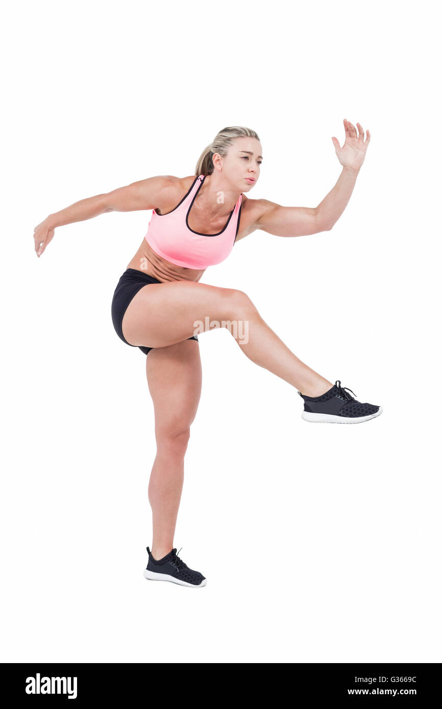 Female athlete jumping Stock Photo