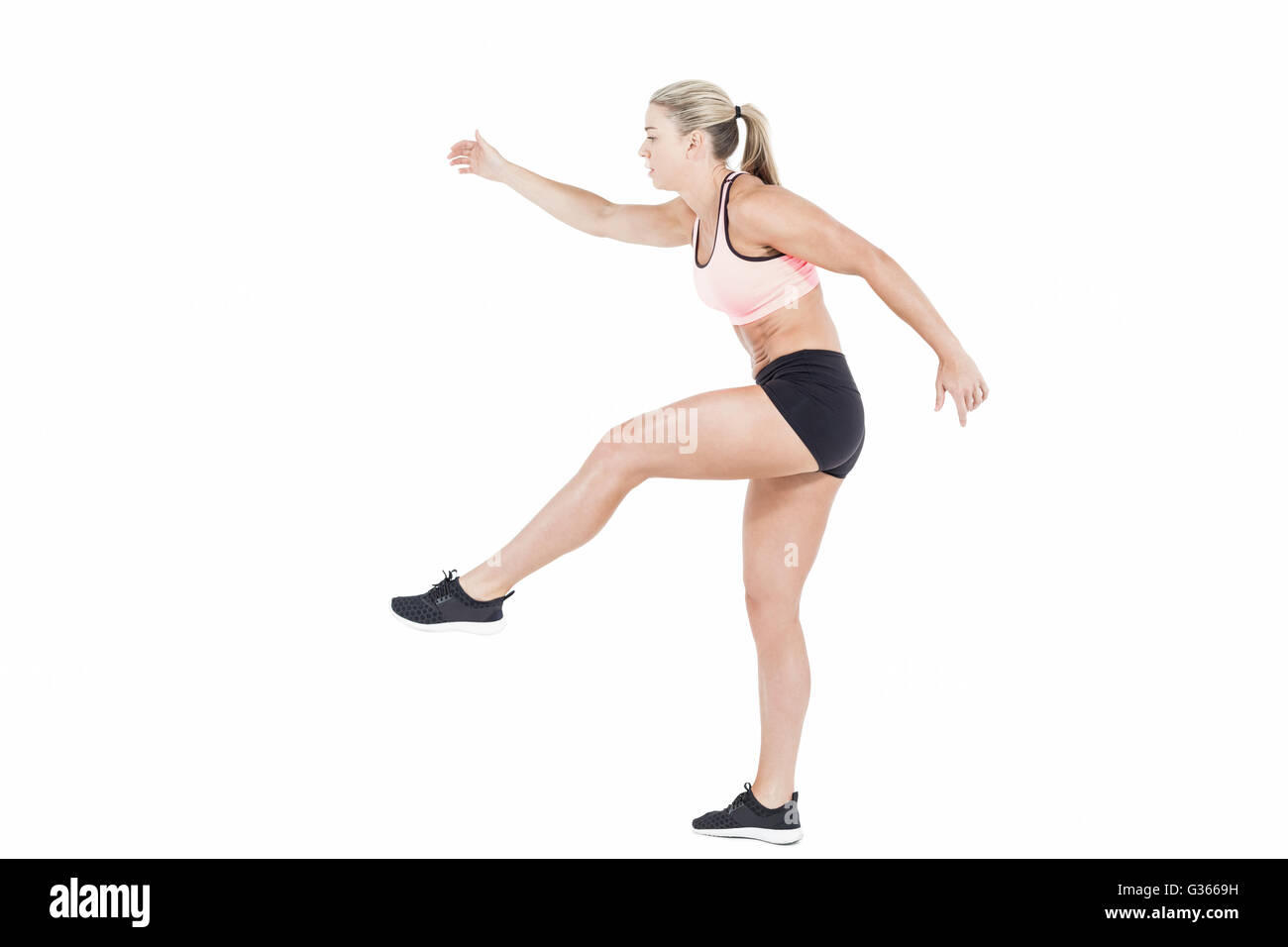 Female athlete jumping Stock Photo
