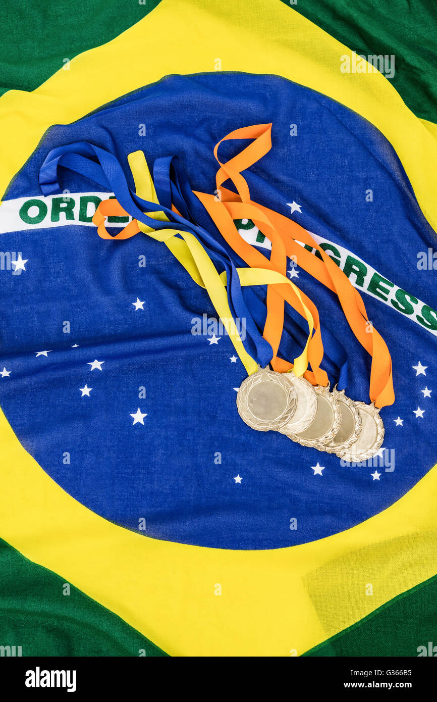 Gold medals on brazilian flag Stock Photo