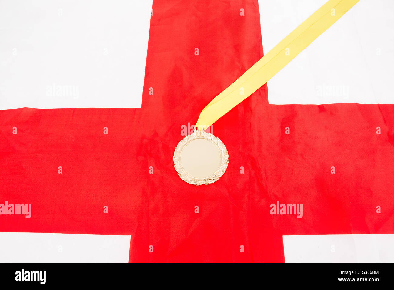 Close-up of gold medal on english flag Stock Photo