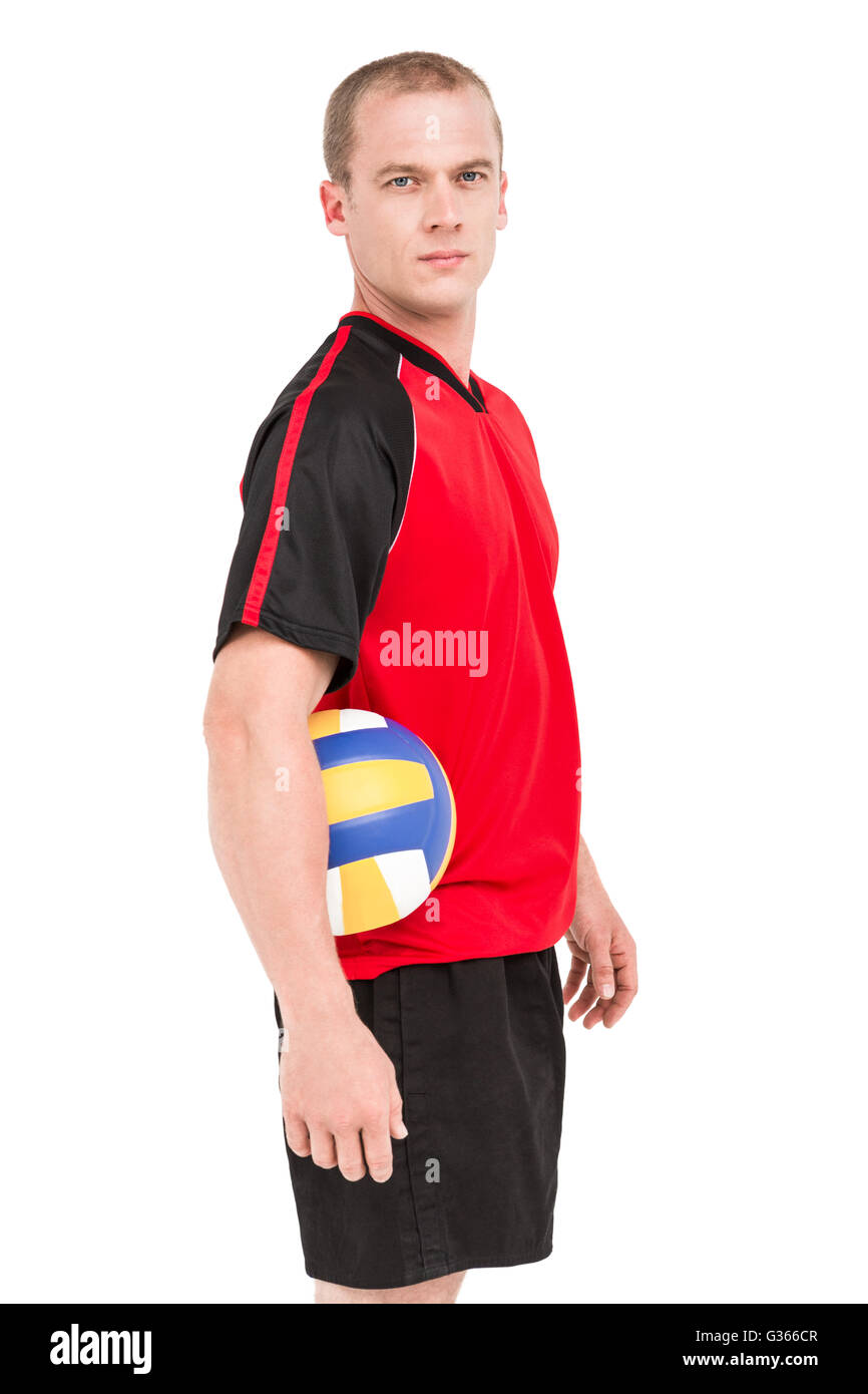 Sportsman holding a volleyball Stock Photo