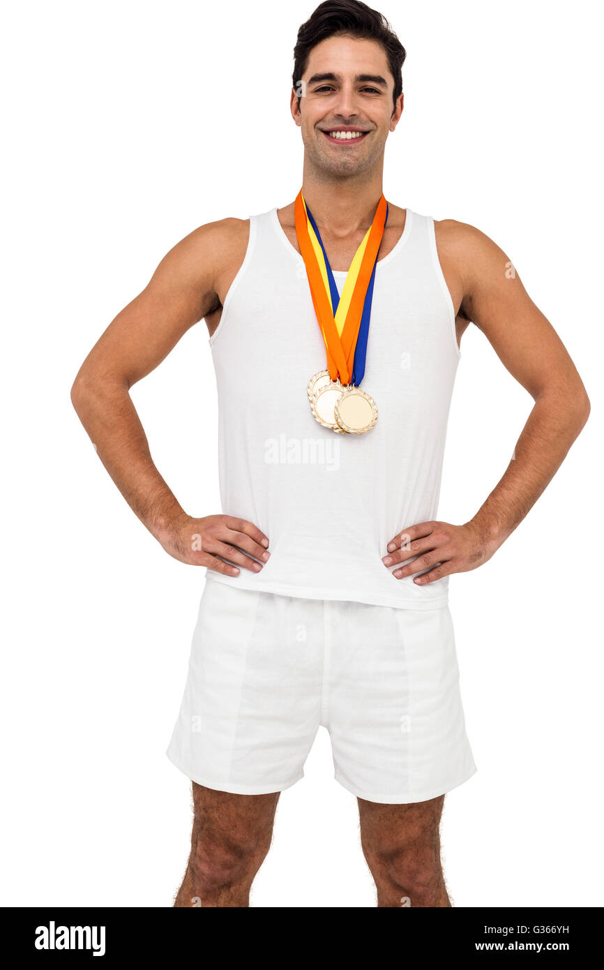 Athlete posing with gold medals around his neck Stock Photo