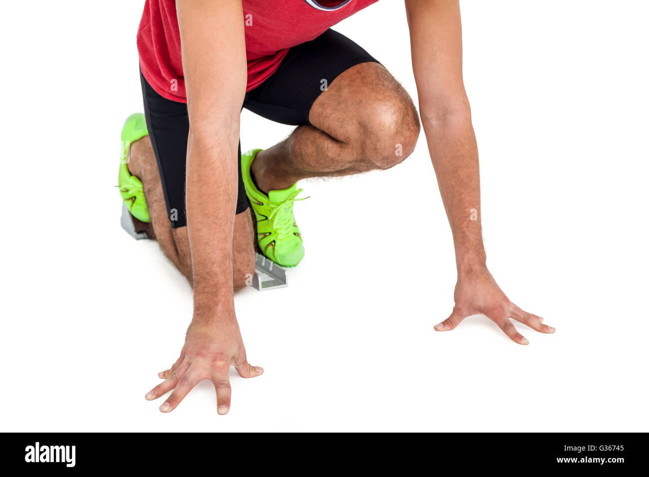 Male athlete in ready to run position Stock Photo