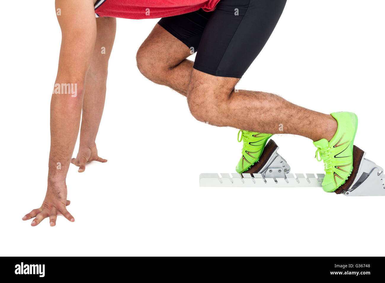 Male athlete in ready to run position Stock Photo