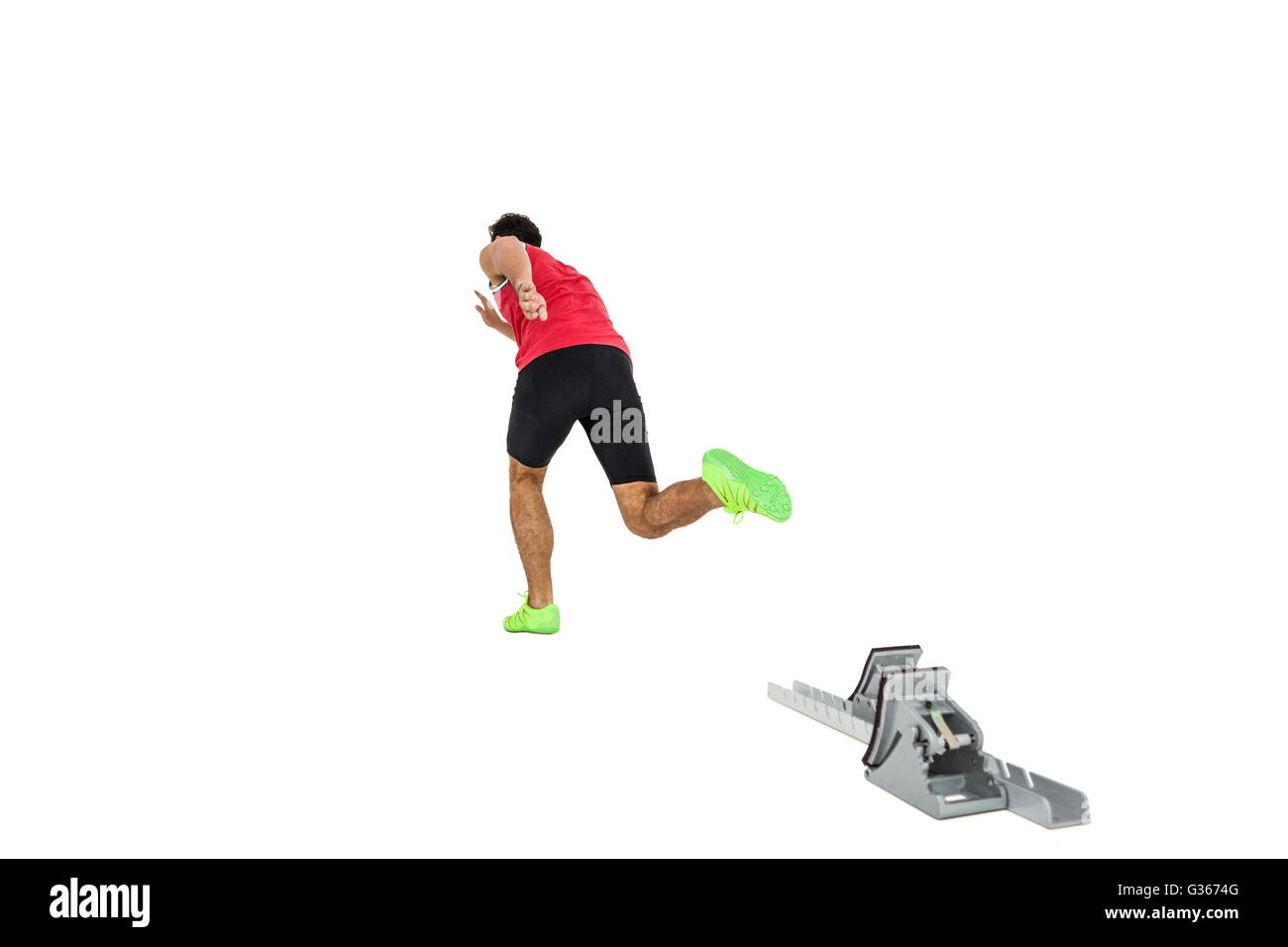 Male athlete running from starting blocks Stock Photo