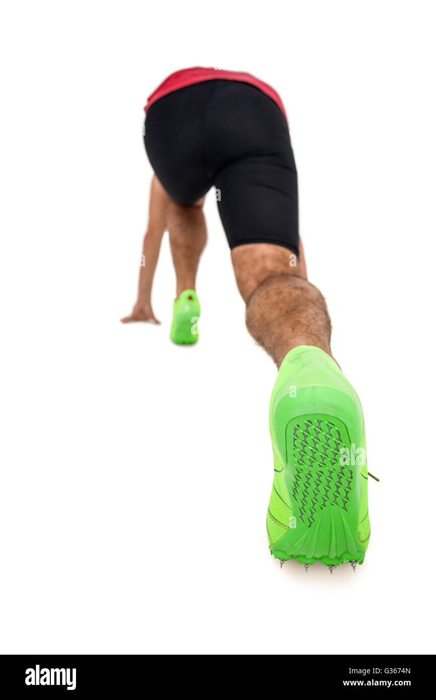 Male athlete in ready to run position Stock Photo