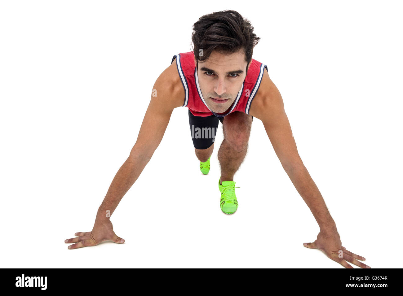 Portrait of male athlete in ready to run position Stock Photo