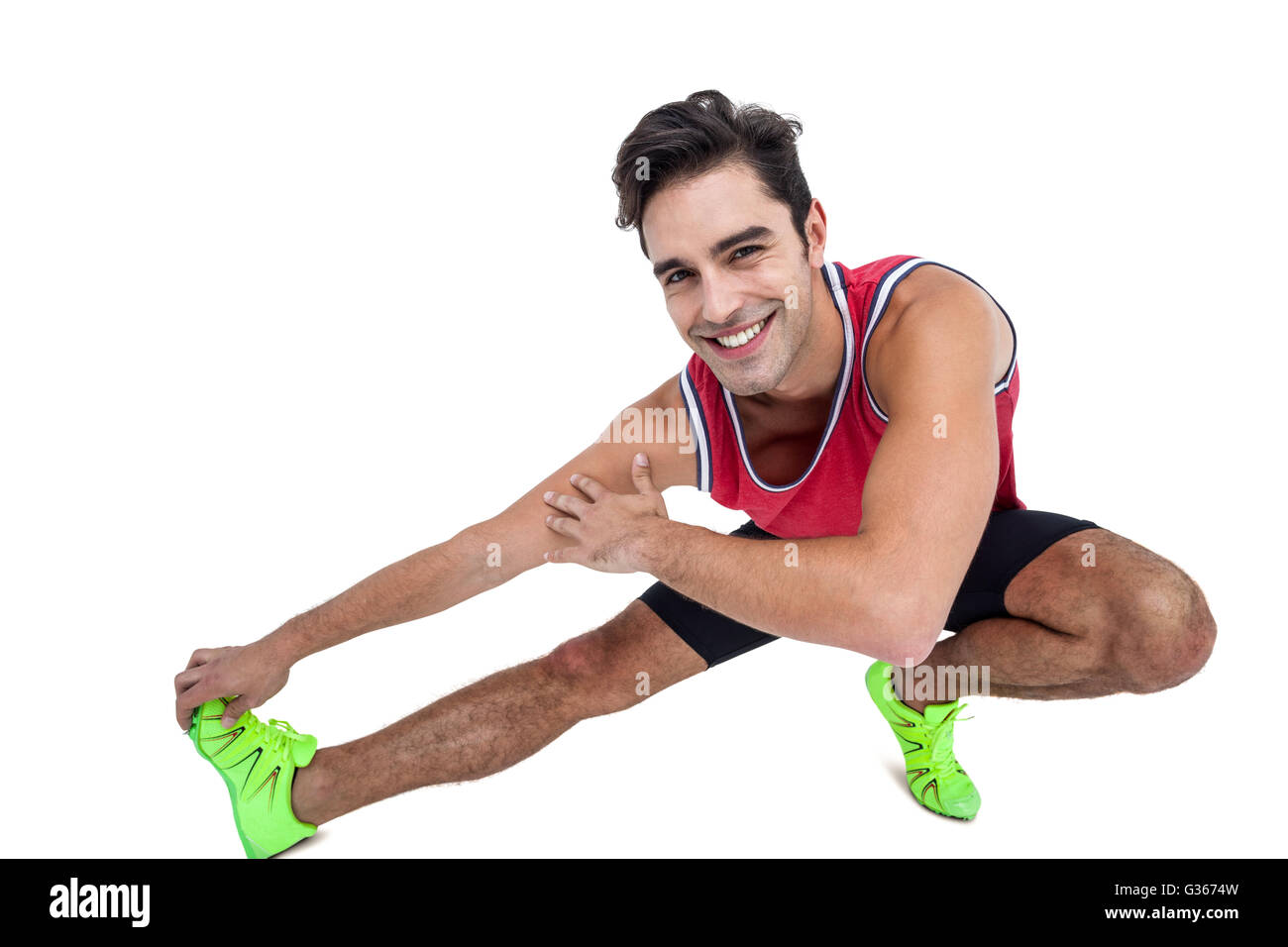 Portrait of male athlete stretching his hamstring Stock Photo