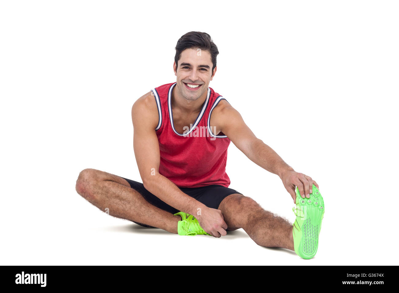 Portrait of male athlete stretching his hamstring Stock Photo