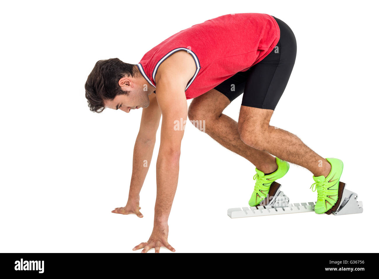 Male athlete in ready to run position Stock Photo