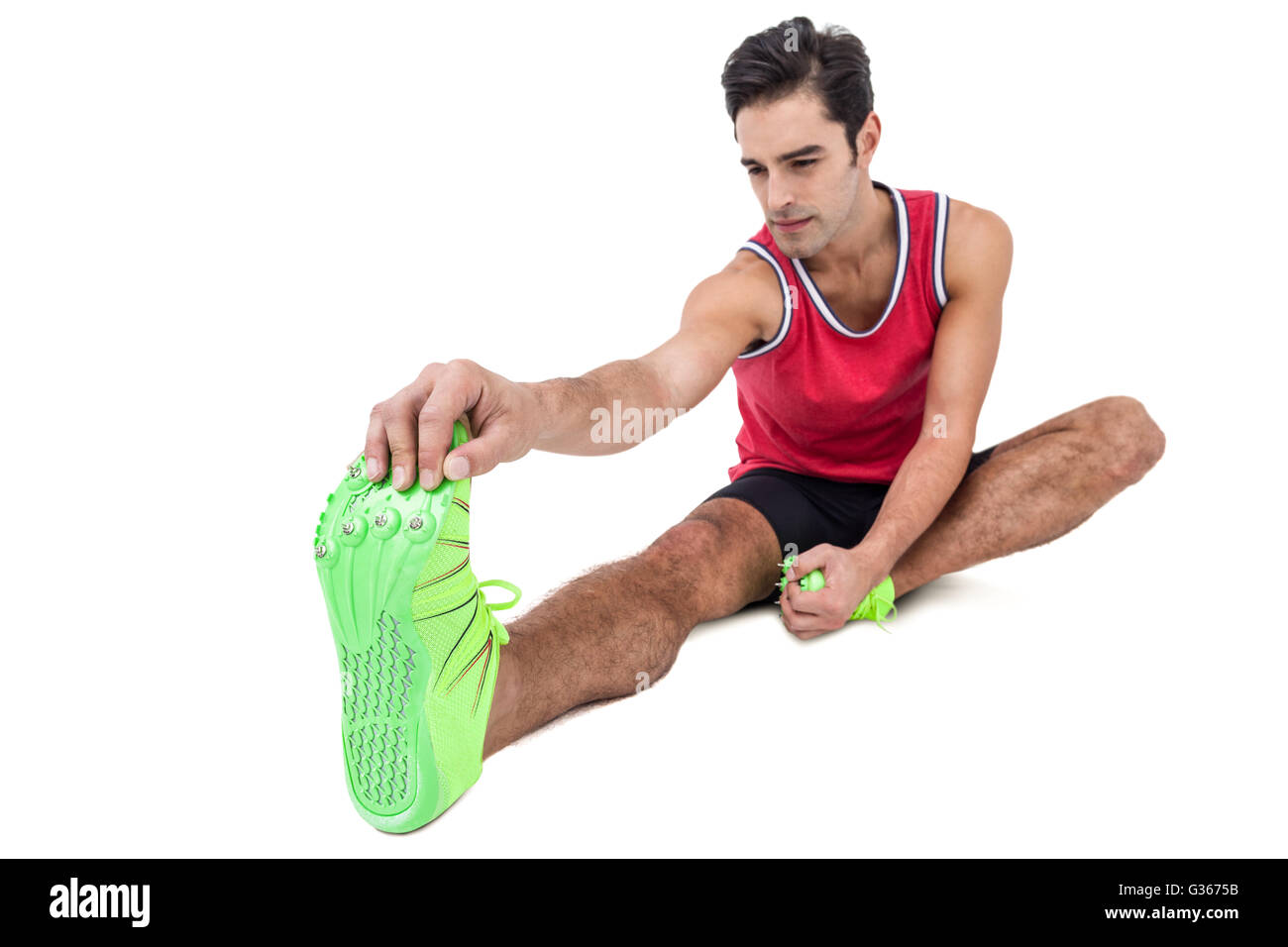 Male athlete doing stretching exercise Stock Photo