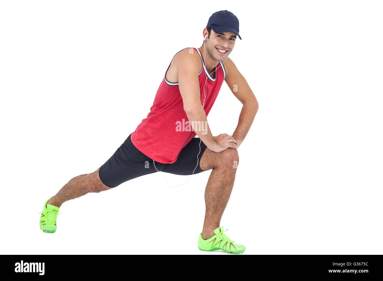 Portrait of male athlete doing stretching exercise Stock Photo