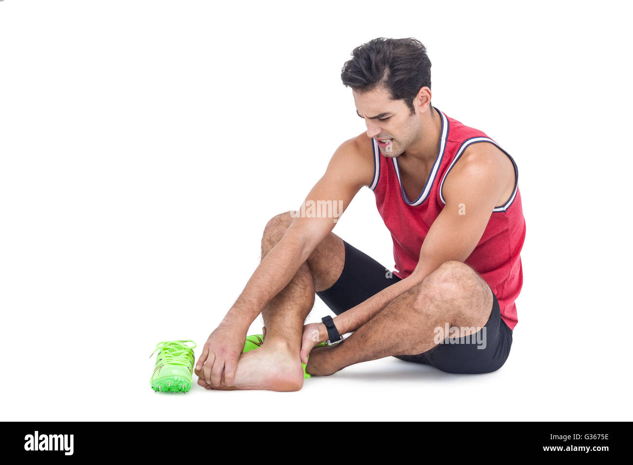 Male athlete with foot pain on white background Stock Photo