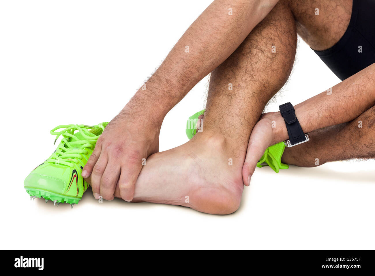 Male athlete with foot pain on white background Stock Photo