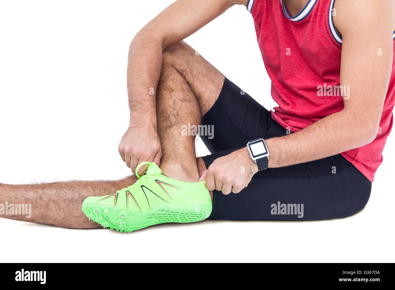 Male athlete wearing his sport shoes and getting ready for sport Stock Photo