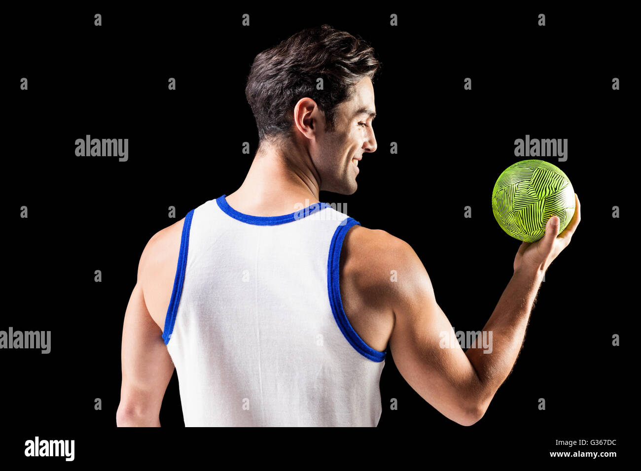 Happy athlete male holding a ball Stock Photo