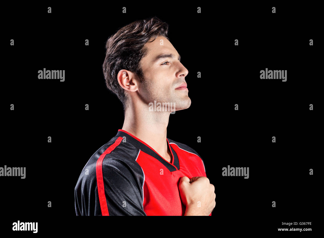 Athlete showing respect during national anthem Stock Photo