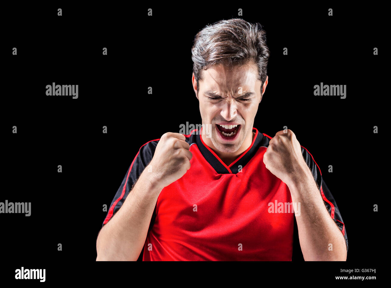 Male athlete posing after victory Stock Photo
