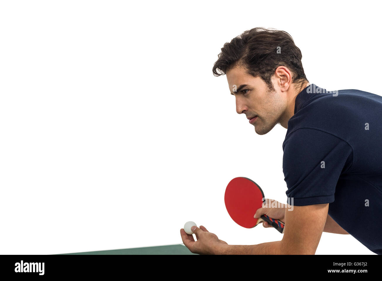 Confident male athlete playing table tennis Stock Photo