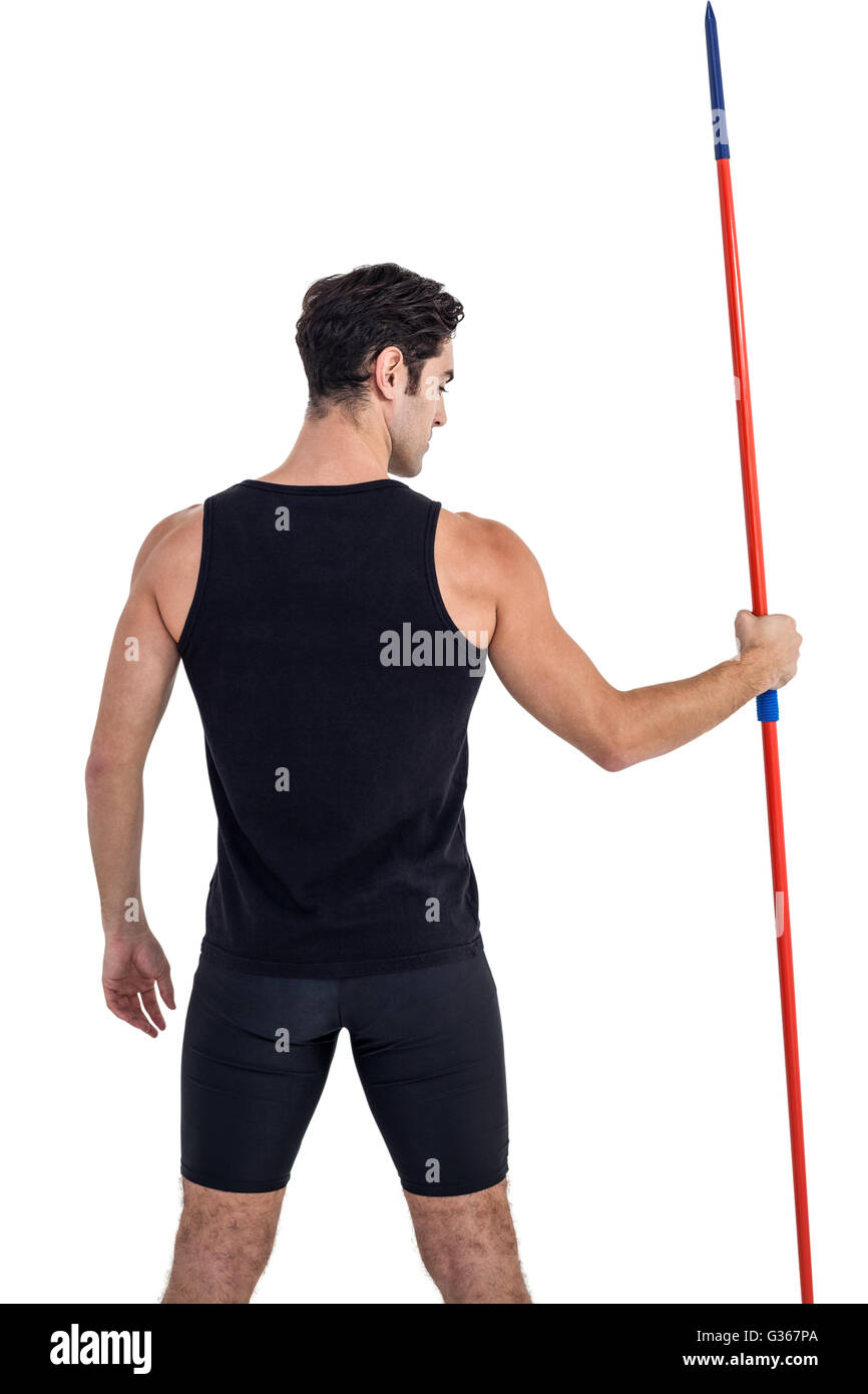Rear view of male athlete holding javelin Stock Photo