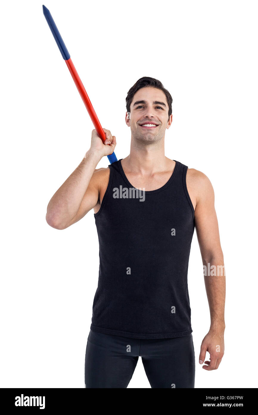 Happy male athlete holding javelin Stock Photo