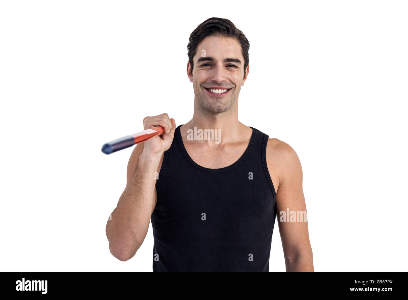 Portrait of happy male athlete holding javelin Stock Photo
