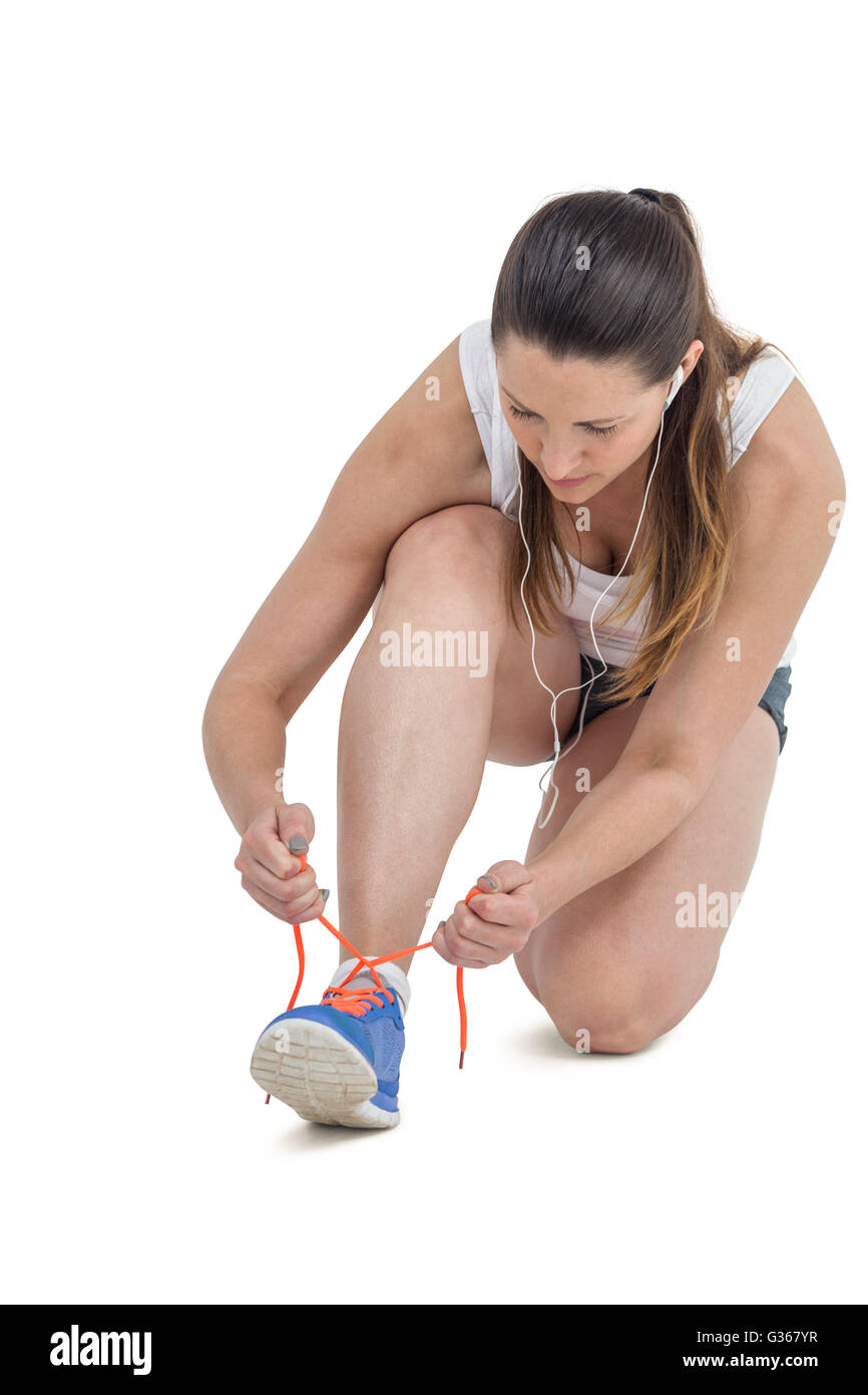 Woman tying shoes hi res stock photography and images Alamy