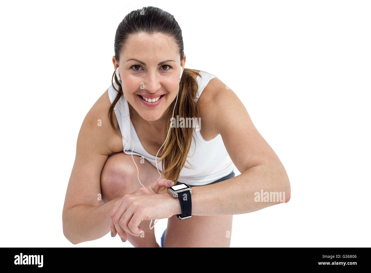 Portrait of athlete woman checking time in wrist watch Stock Photo