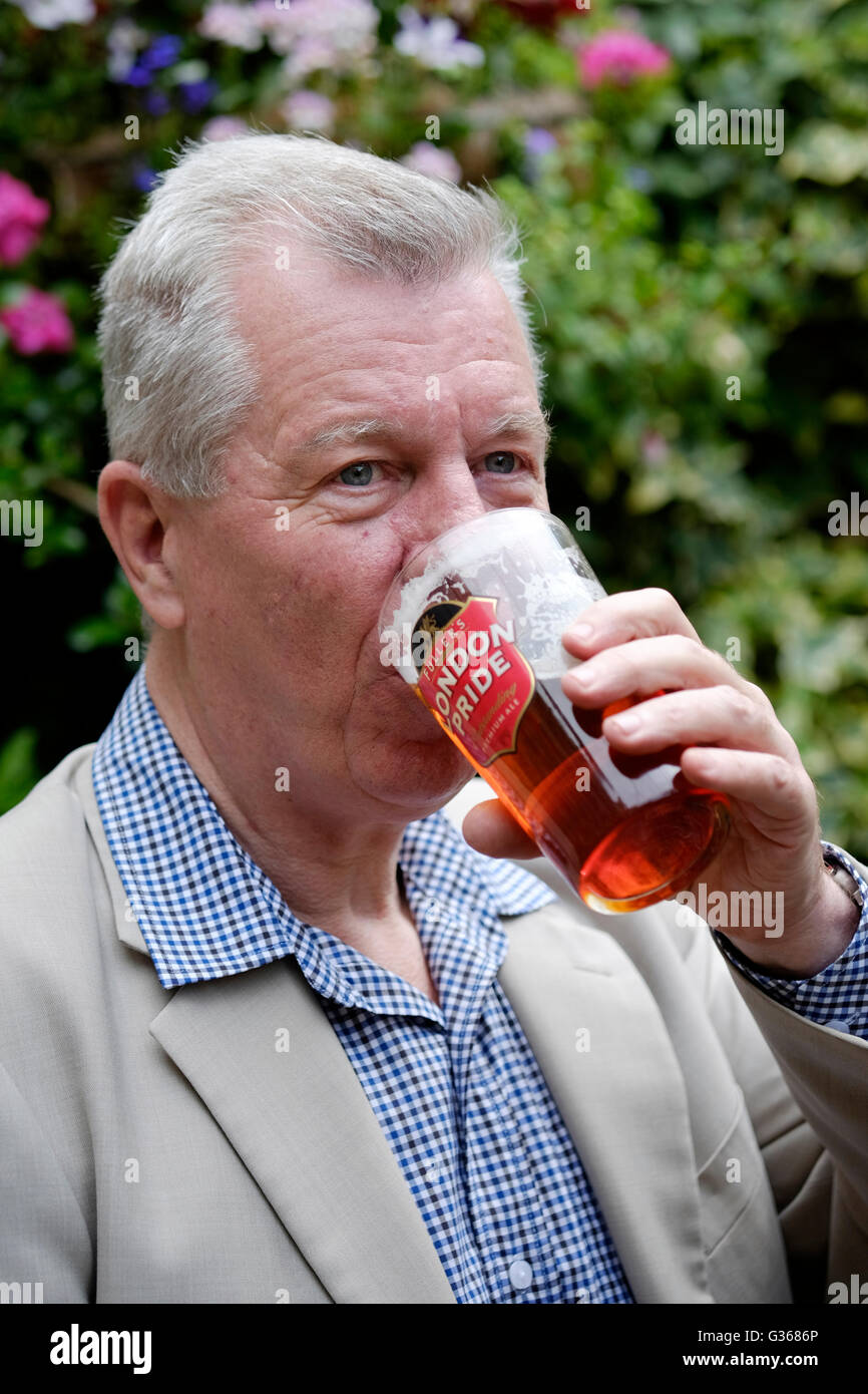 a retired male enjoying a pint of beer in a pub garden england uk Stock ...