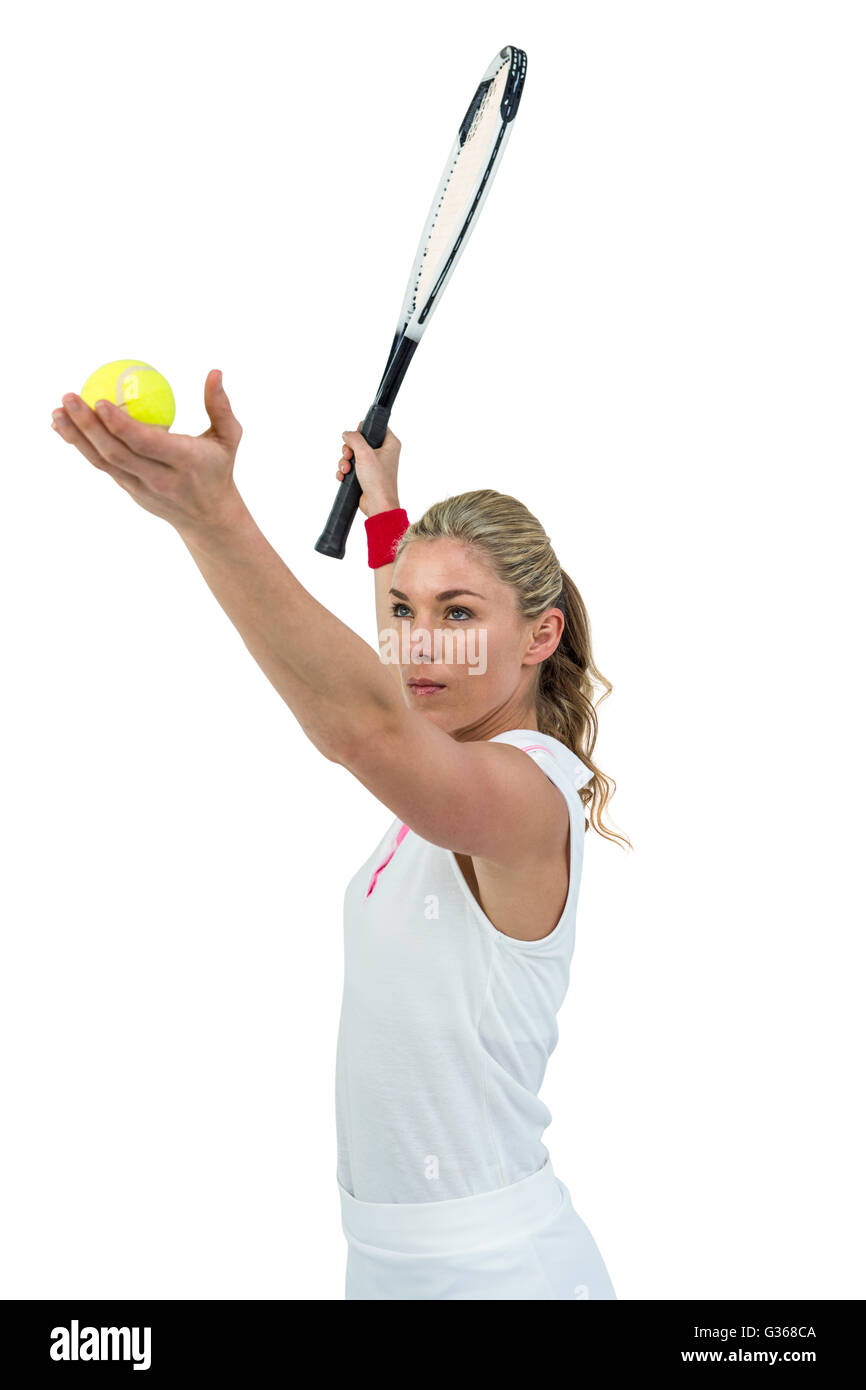 Athlete holding a tennis racquet ready to serve Stock Photo