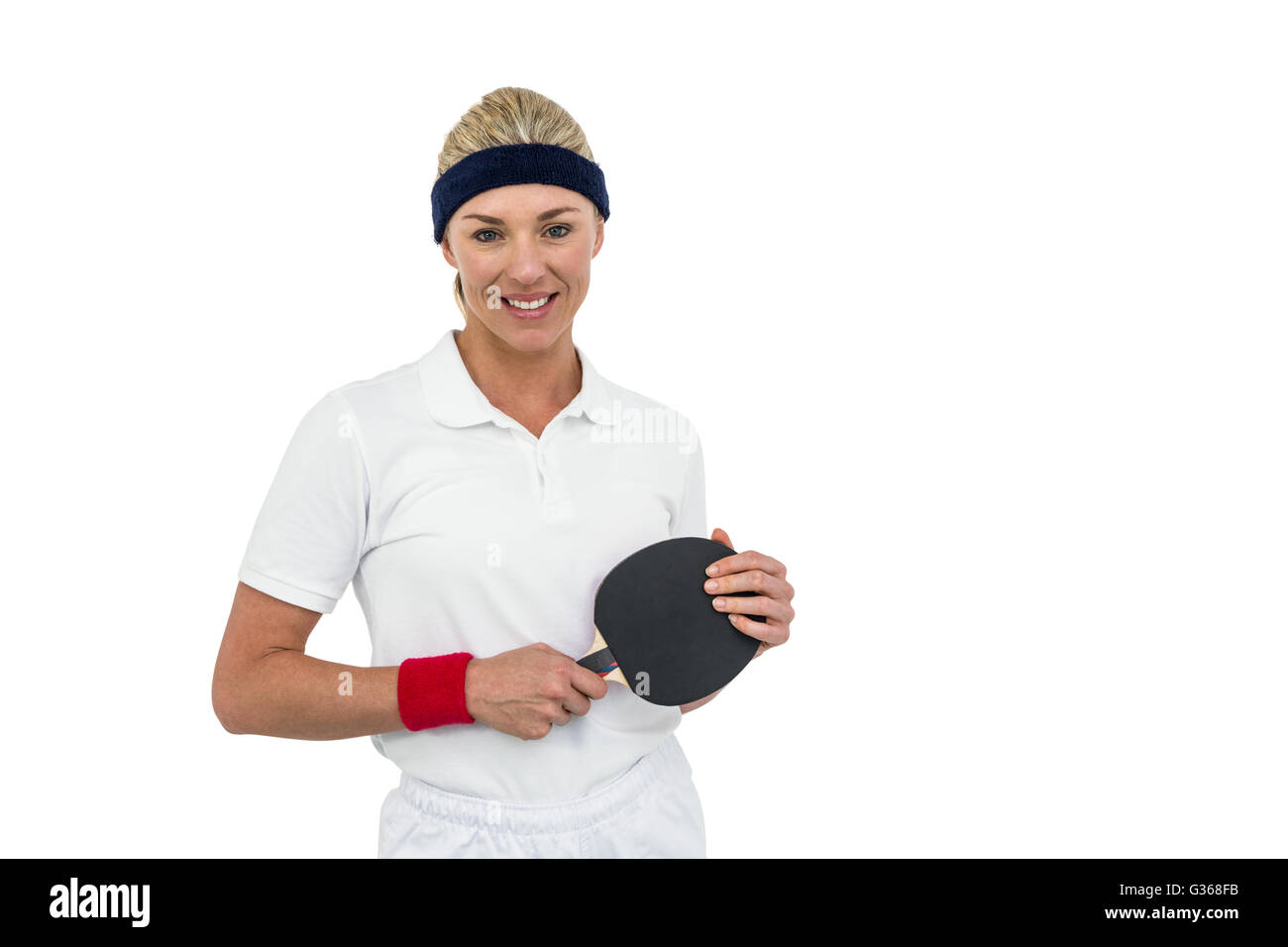 Female athlete holding table tennis paddle Stock Photo