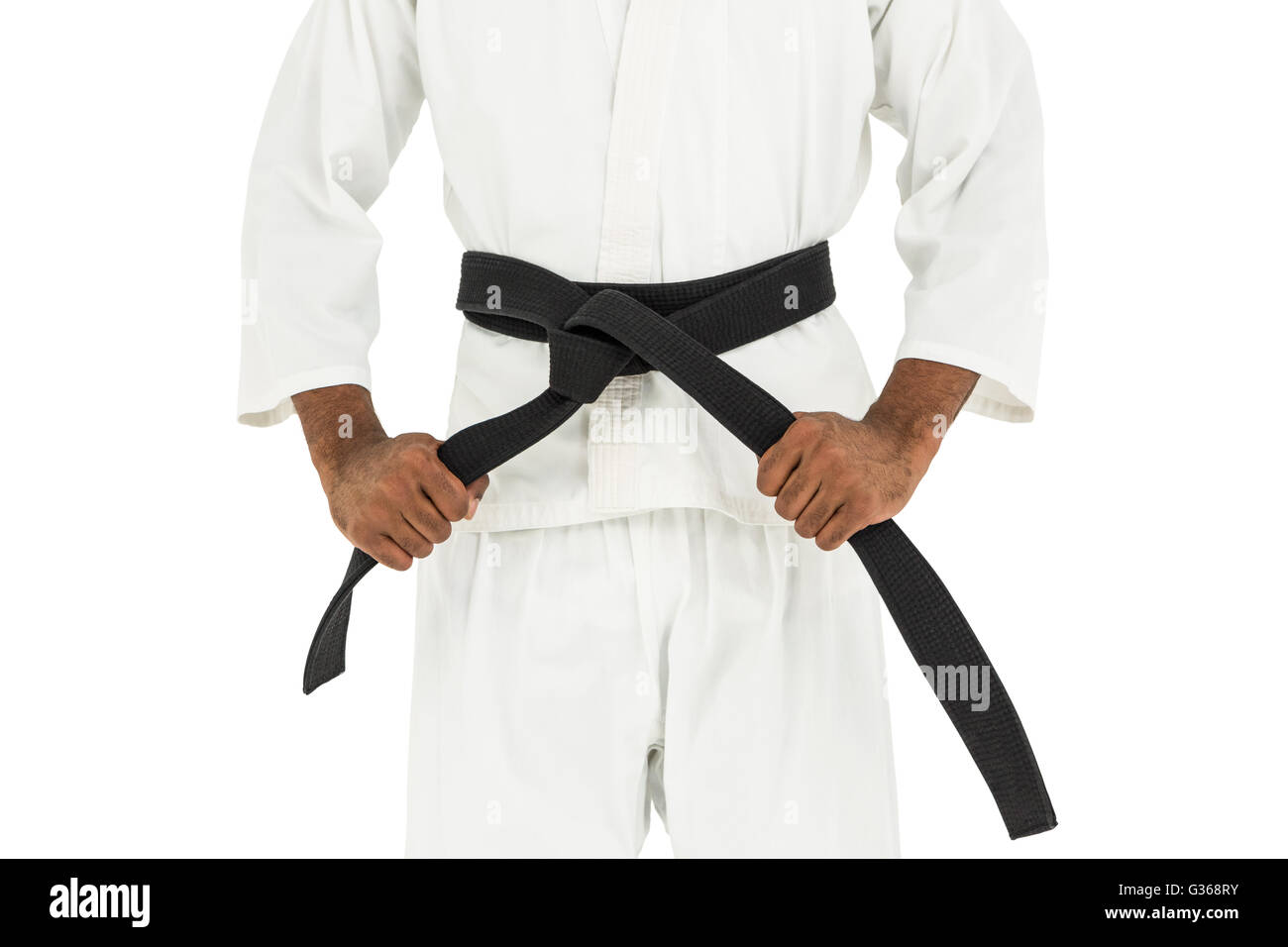 Fighter tightening karate belt Stock Photo Alamy