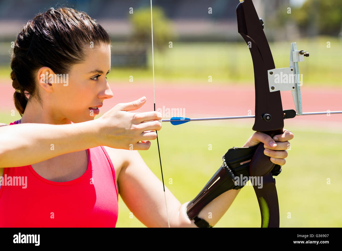 Female athlete practicing archery Stock Photo - Alamy