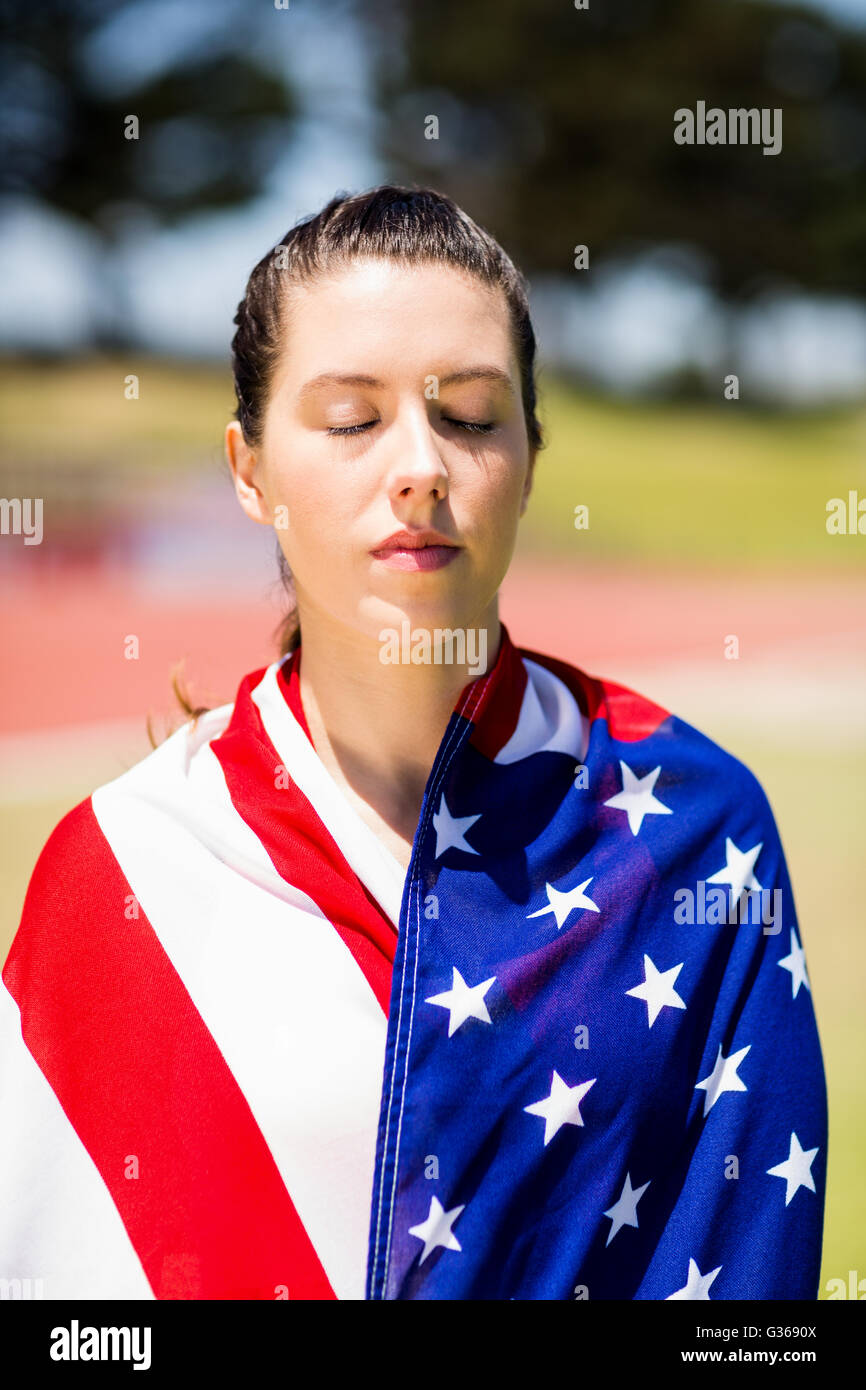 Female athlete wrapped in american flag Stock Photo Alamy