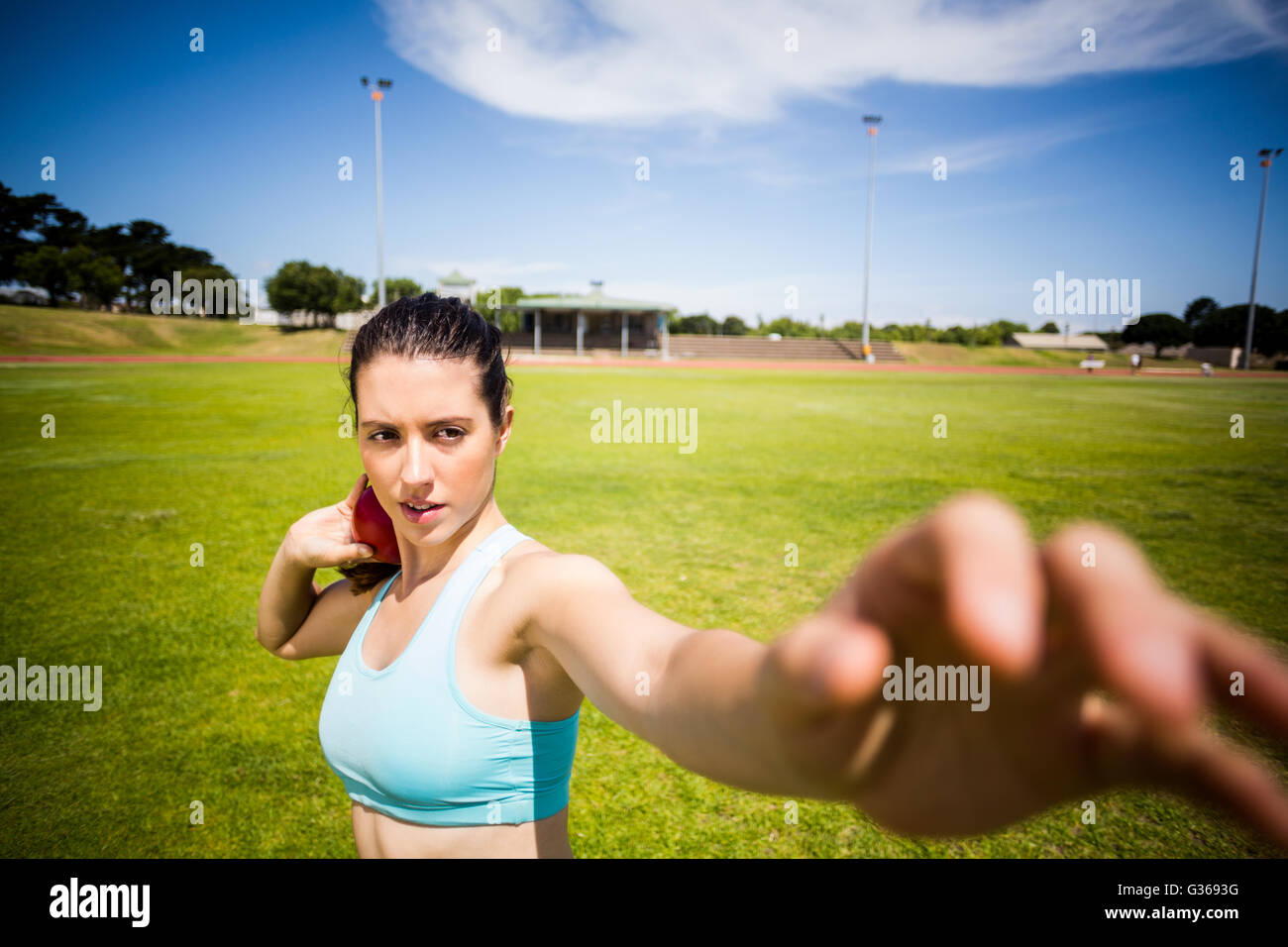 Female athlete preparing to throw shot put ball Stock Photo Alamy