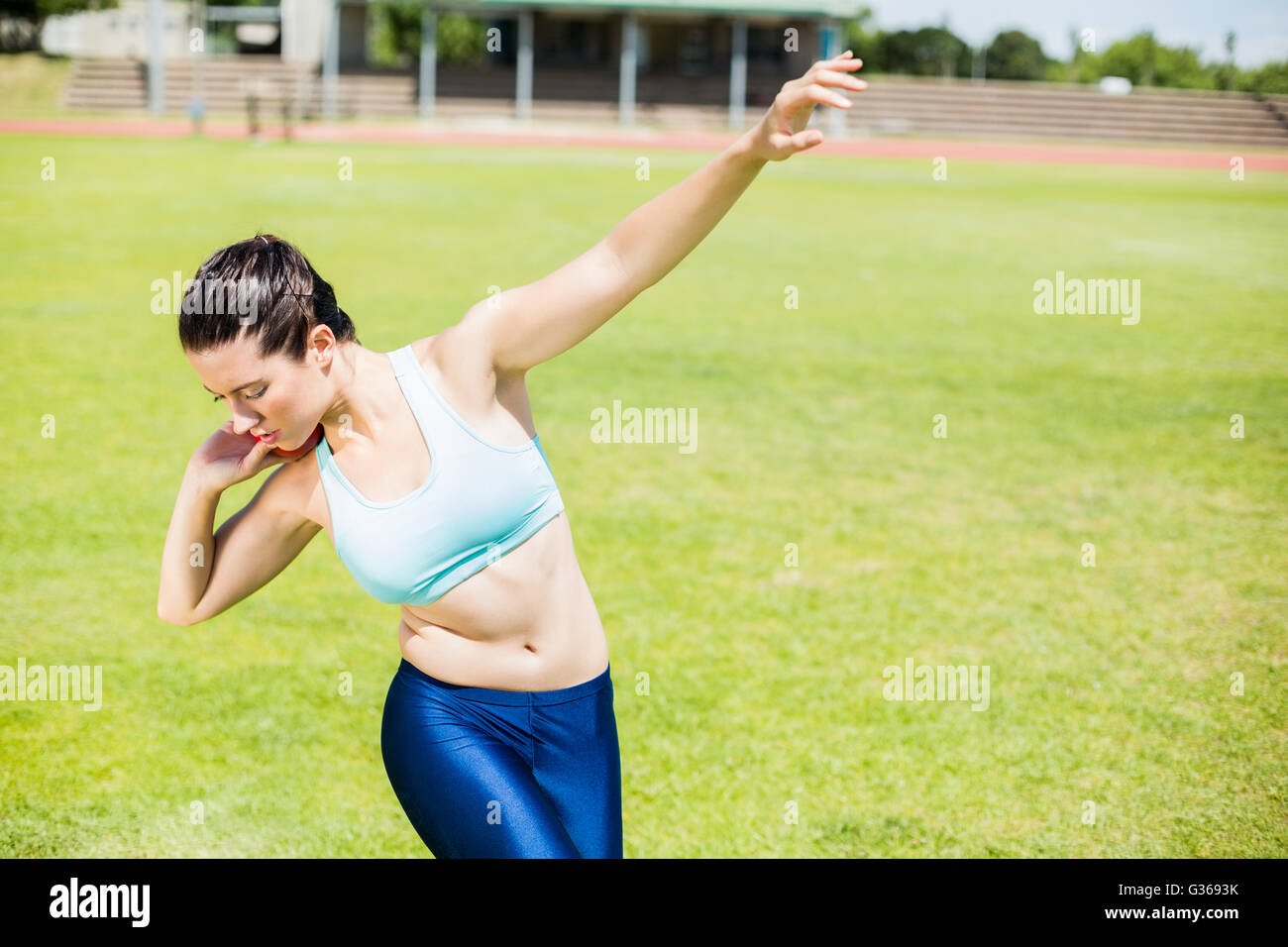 Female athlete preparing to throw shot put ball Stock Photo Alamy