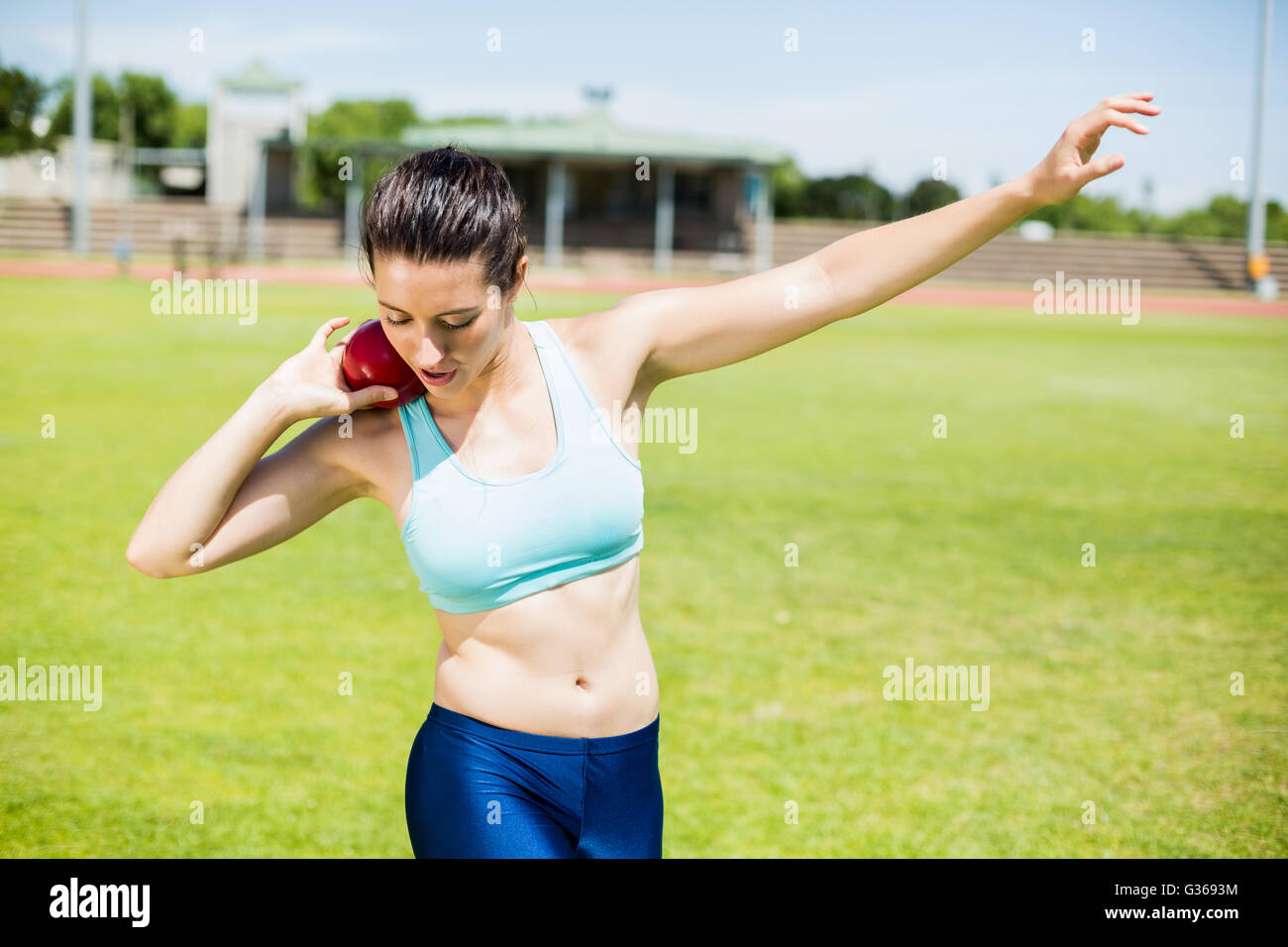 Female athlete preparing to throw shot put ball Stock Photo Alamy